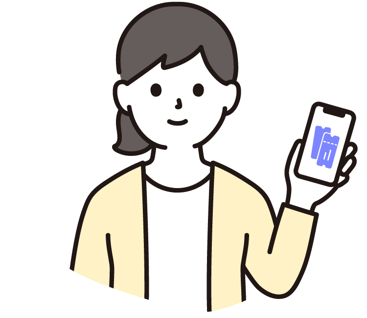 パソコンの前でスマホを持っている女性